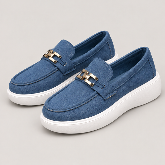 Blue round toe slip-ons, studio view