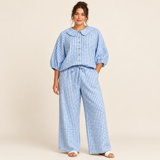 Light blue plaid button-up shirt and matching pants set in a studio view